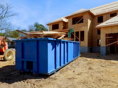 Paul Harper, founder of North Star Disposal, coordinating a dumpster delivery in Austin